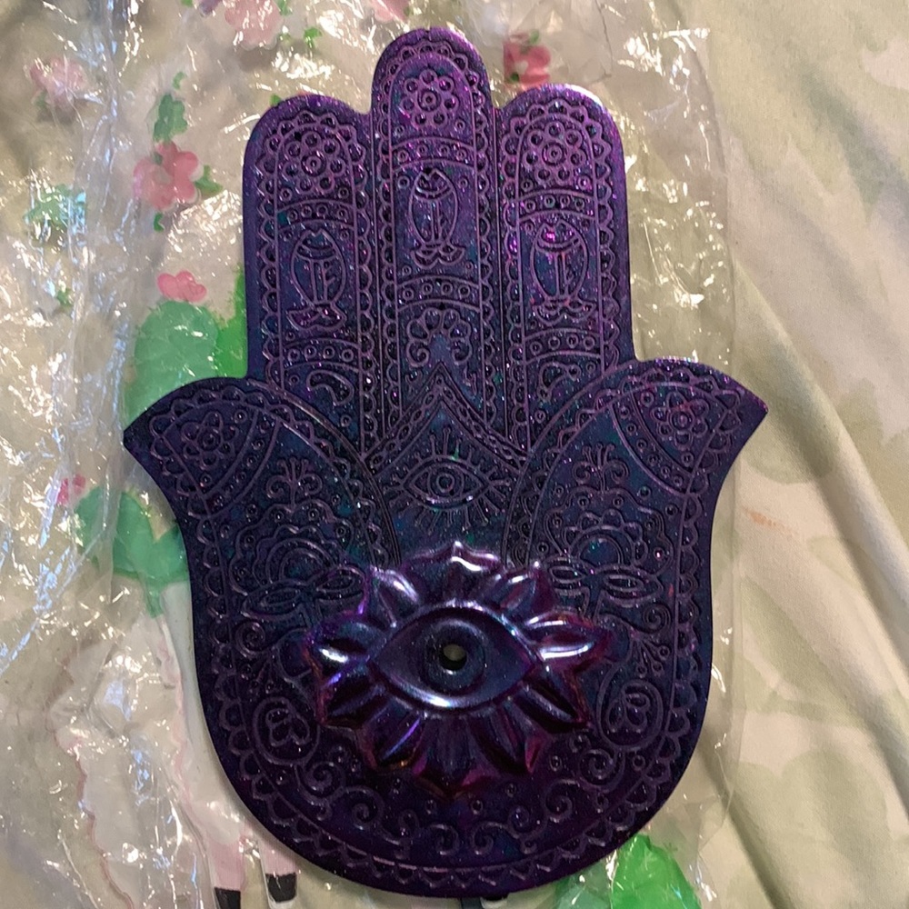 Hamsa resin incense holder.